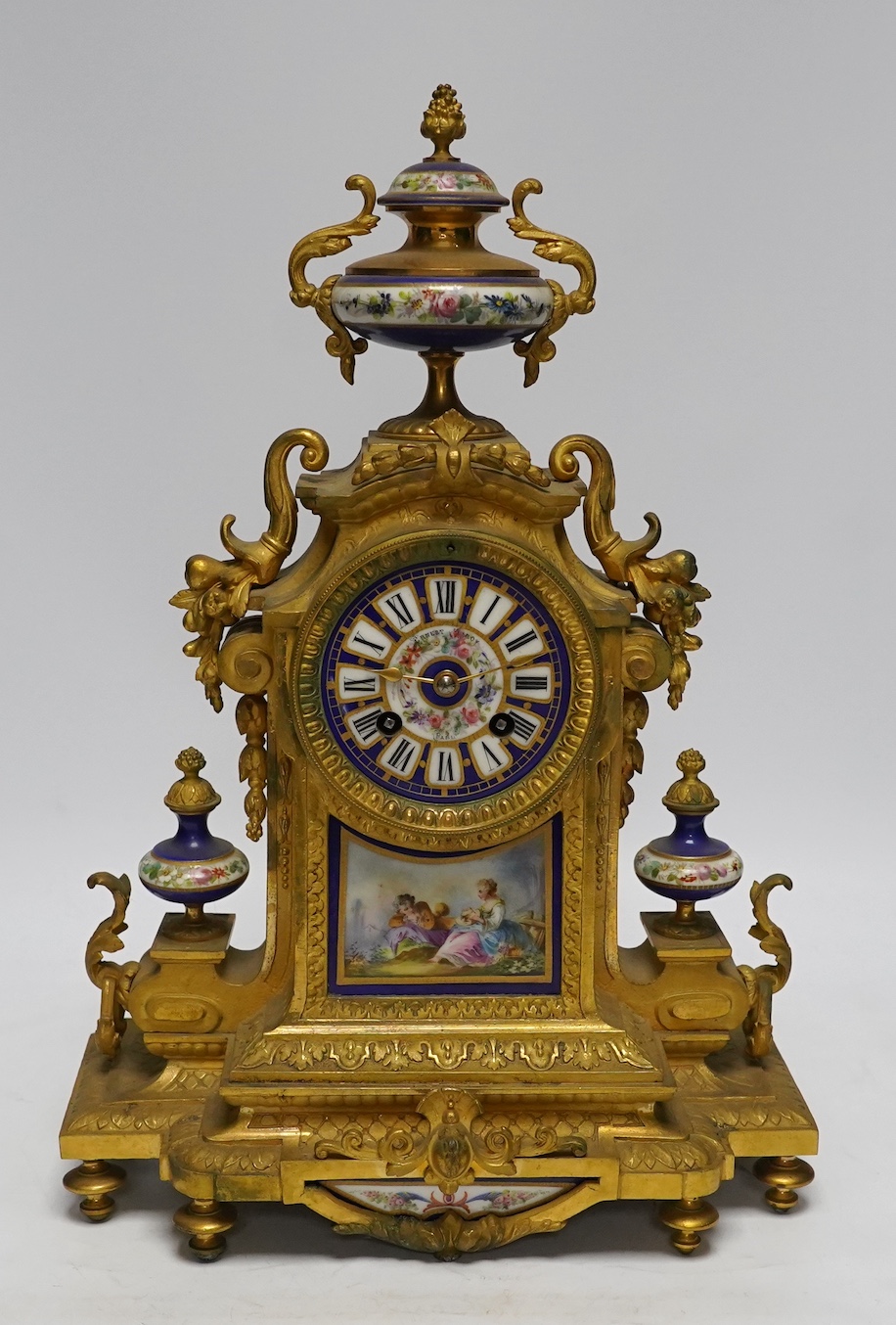 A late 19th century French ormolu mantel clock, MR and Co. Ernest Viroy, with key and pendulum, 39cm